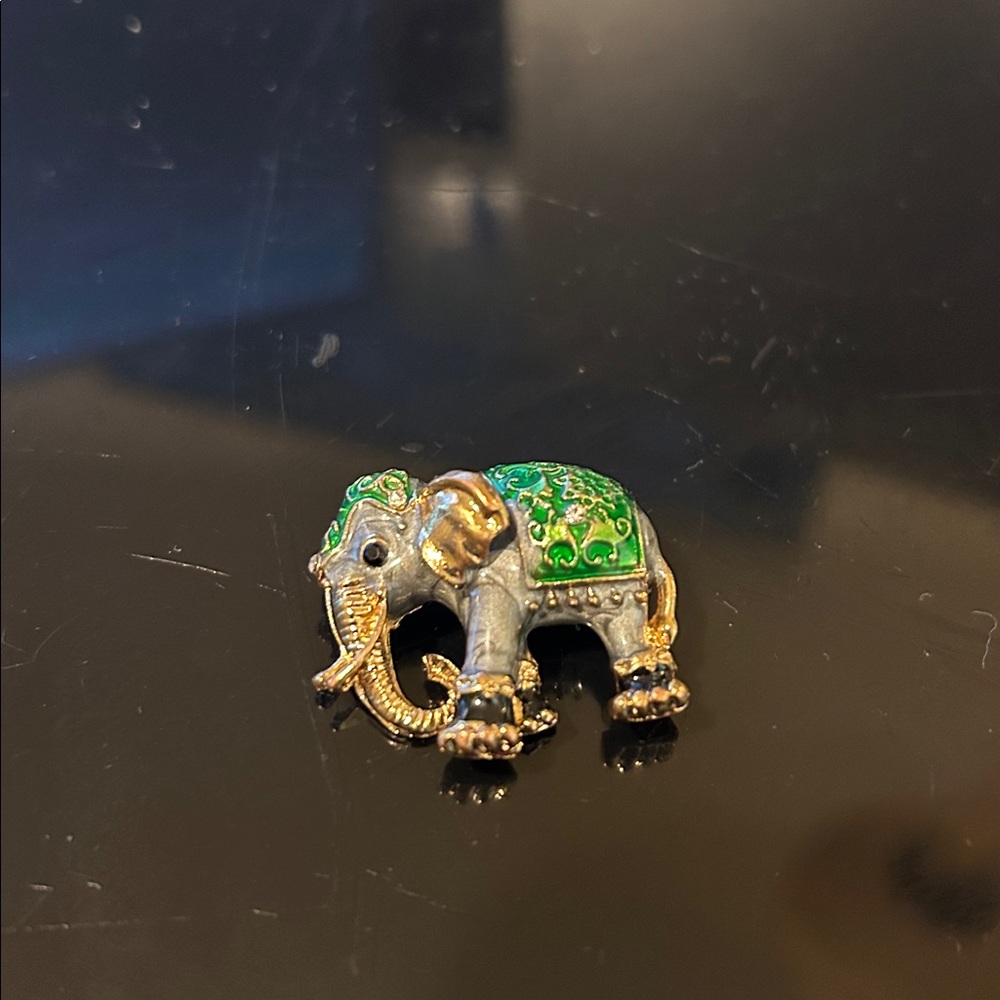 Elegant Elephant Brooch with Green and Gold Accents